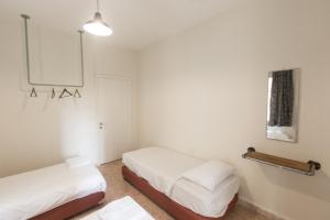 Voodi või voodid majutusasutuse The Grand Meshmosh Hotel toas