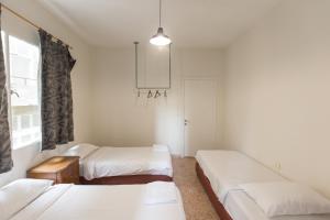 Voodi või voodid majutusasutuse The Grand Meshmosh Hotel toas