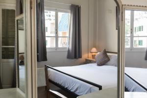 Voodi või voodid majutusasutuse The Grand Meshmosh Hotel toas