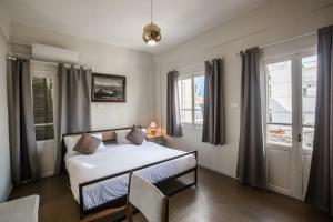 Voodi või voodid majutusasutuse The Grand Meshmosh Hotel toas