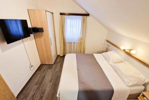 Postel nebo postele na pokoji v ubytování Rooms Ruza + 37 fotografií