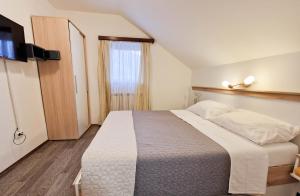 Postel nebo postele na pokoji v ubytování Rooms Ruza