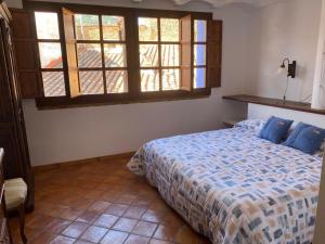 En eller flere senge i et værelse på CASA MIRIAM