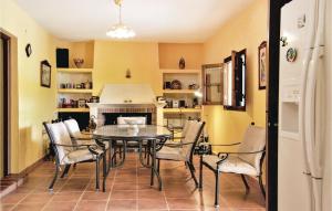 a dining room with a table and chairs in a kitchen at Stunning Home In Cortegana With Private Swimming Pool, Can Be Inside Or Outside in Cortegana