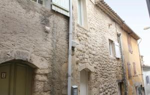 a stone building with a door in a street at Stunning Home In Reillanne With Wifi in Reillanne +7 photos