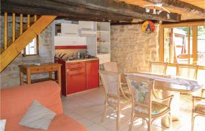 a kitchen and dining room with a table and chairs at Lovely Home In Padirac With Wifi in Padirac