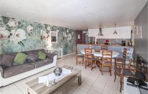 a living room with a couch and a table at Amazing Home In Lançon De Provence in Lançon-Provence