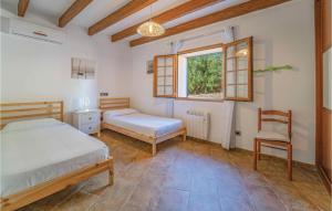 A bed or beds in a room at Villa Janet