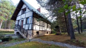 a house in the middle of a forest at Raduńska Ostoja in Dziemiany