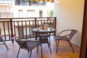 a small table and chairs on a balcony at Santa Marina,Sozopol,apt.901-43 in Sozopol