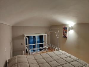 a bedroom with a bed and a window at APPARTAMENTO INCANTEVOLE : TORINO in Turin