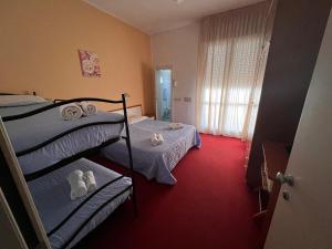 Postel nebo postele na pokoji v ubytování Villa Silvie Rose