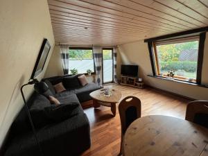 a living room with a couch and a table at Haus Luzia in Meschede