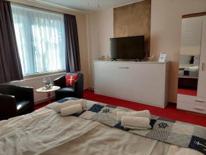 Postel nebo postele na pokoji v ubytování Hotel Rosmarin
