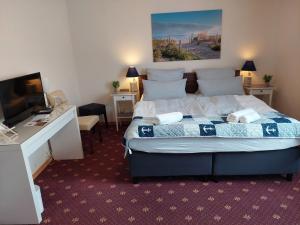 Postel nebo postele na pokoji v ubytování Hotel Rosmarin