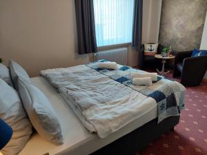 Postel nebo postele na pokoji v ubytování Hotel Rosmarin