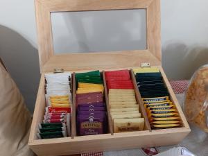 a wooden box filled with different types ofothes at Bed & Breakfast La Casa Antica in Macomer