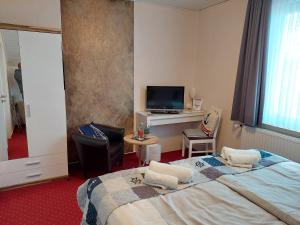 Postel nebo postele na pokoji v ubytování Hotel Rosmarin