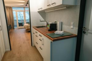 a kitchen with a sink and a counter top at Möhnestube mit Seeblick, Pool und Sauna in Möhnesee