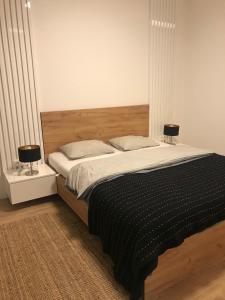 Postel nebo postele na pokoji v ubytování Apartmán s vyhliadkou