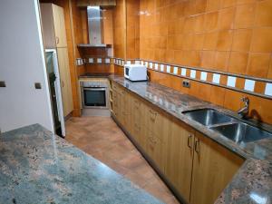 a kitchen with a sink and a counter top at Apartment in Llavorsi in the heart of the Catalan Pyrenees in Llavorsí