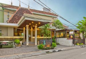 a building on the side of a street at The Rani Hotel & Spa in Kuta
