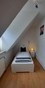Ferienhaus Luetje-Huuske tesisinde bir odada yatak veya yataklar