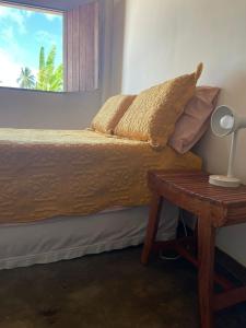 Tempat tidur dalam kamar di Pousada Ecó Milagres - Praia