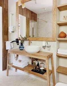 a bathroom with a sink and a mirror at PRZYTULIA in Olsztyn