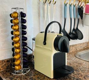 a toaster sitting on a kitchen counter with utensils at Blue House Mallorca in Ses Salines
