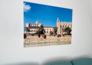 a picture of a cathedral and a building at Blue House Mallorca in Ses Salines