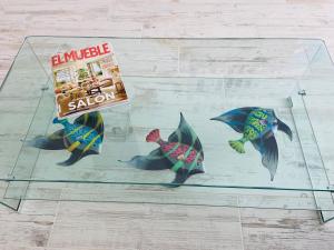 a display case with three fish and a package of sushi at Blue House Mallorca in Ses Salines