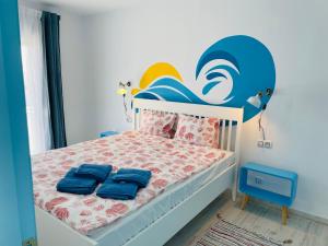 A bed or beds in a room at Blue House Mallorca
