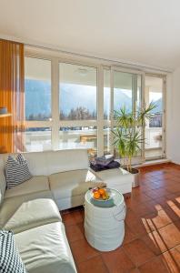 a living room with a couch and a table at CitySuite Lienz in Lienz