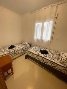 Ένα ή περισσότερα κρεβάτια σε δωμάτιο στο Home sweet Home