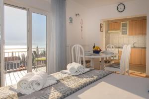 Posteľ alebo postele v izbe v ubytovaní Apartmani Tena