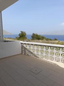a balcony with a view of the ocean at Avra Studios in Masouri