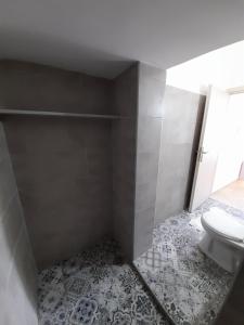 a bathroom with a sink and a toilet at Avra Studios in Masouri