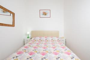 Ένα ή περισσότερα κρεβάτια σε δωμάτιο στο Il Riccio Apartment 28