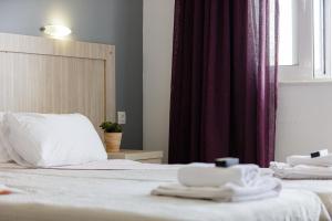 Posteľ alebo postele v izbe v ubytovaní Yiannis Apartments