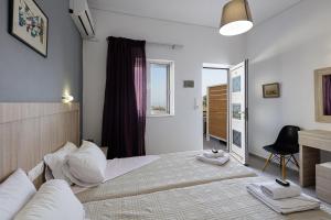 Posteľ alebo postele v izbe v ubytovaní Yiannis Apartments