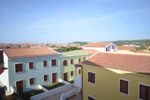 a group of buildings with red roofs at Appartamento residence casa vacanza in Santa Teresa Gallura