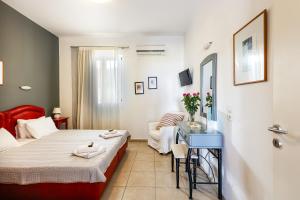 Posteľ alebo postele v izbe v ubytovaní Yiannis Apartments