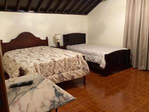 En eller flere senge i et værelse på Terras de Santo Antonio