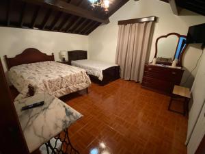 En eller flere senge i et værelse på Terras de Santo Antonio