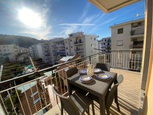 a balcony with a table and chairs on a balcony at The Reef Apartment in Sorrento