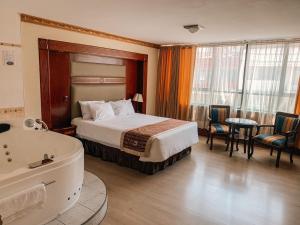 Postel nebo postele na pokoji v ubytování Hotel Oro Inn