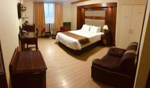 Postel nebo postele na pokoji v ubytování Hotel Oro Inn