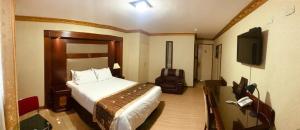 Postel nebo postele na pokoji v ubytování Hotel Oro Inn