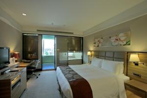 Postel nebo postele na pokoji v ubytování Fullon Hotel Taipei, Central